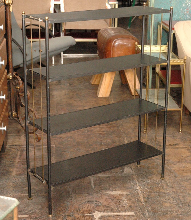 Leather etagere by Jacques Adnet