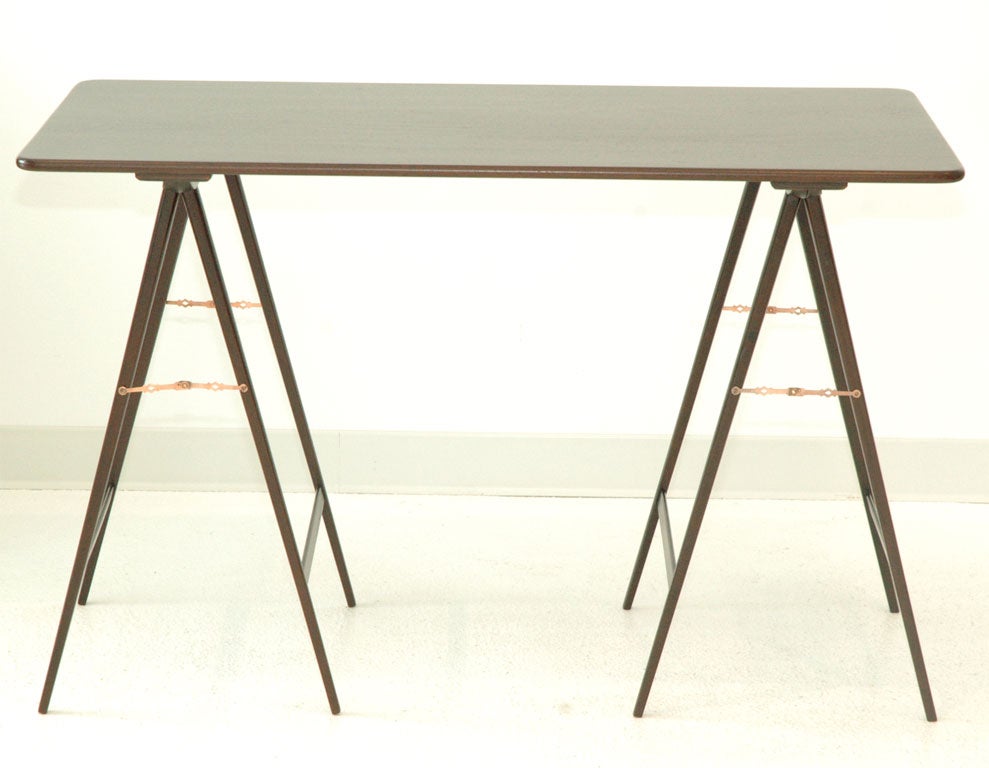 A Mahogany "Campaign" Table with Folding Legs