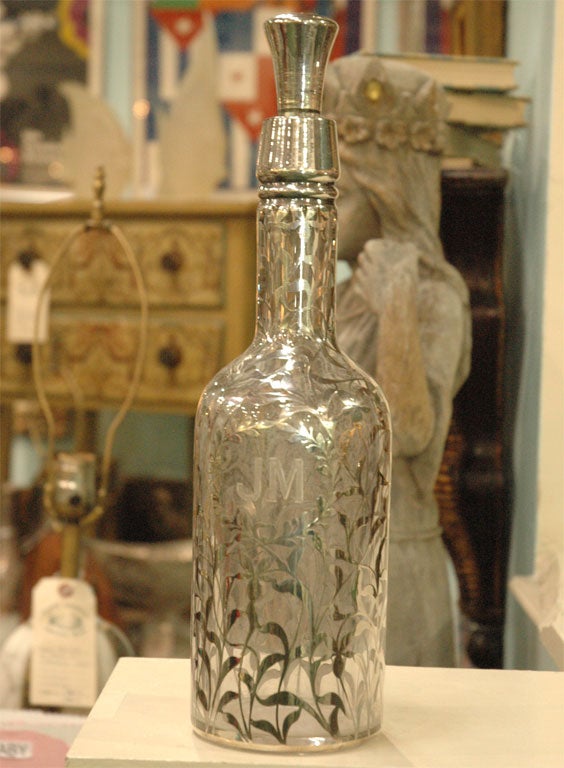 C. 1870 sterling silver overlay decanter with sterling overlay stopper. Excellent condition, elegant pattern, and a monogram of the initials JM.