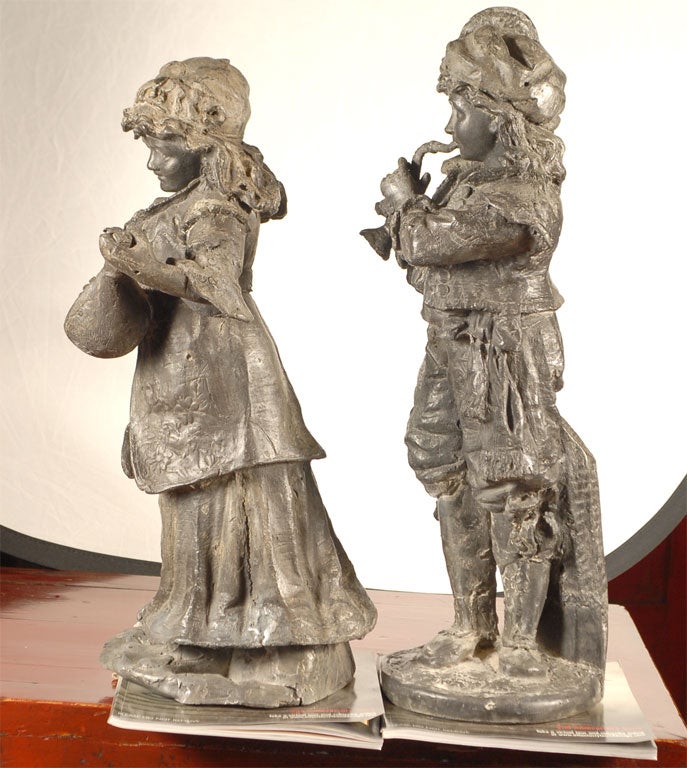 19th century, fine quality pair of Dutch, (Dutch Empire period) lead statues; a boy and girl playing musical instruments; exceptional details!