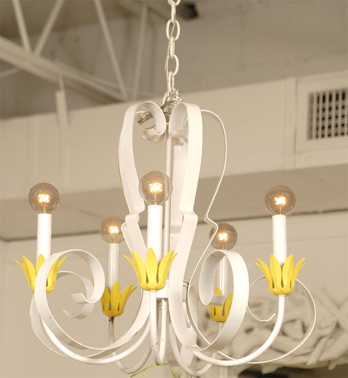 Bright yellow petal detail.  Painted white. New candle sleeves.  Five arm light. 60W max each.