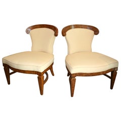 Pair of mid century low "chauffeuses" chairs.