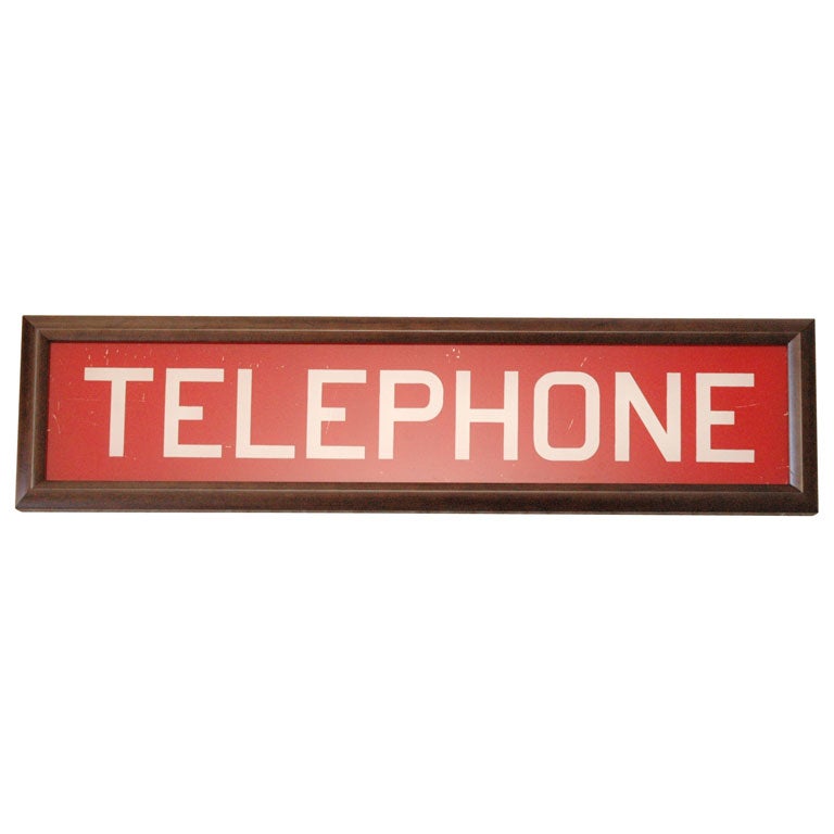 Glass Sign from a Phone Booth
