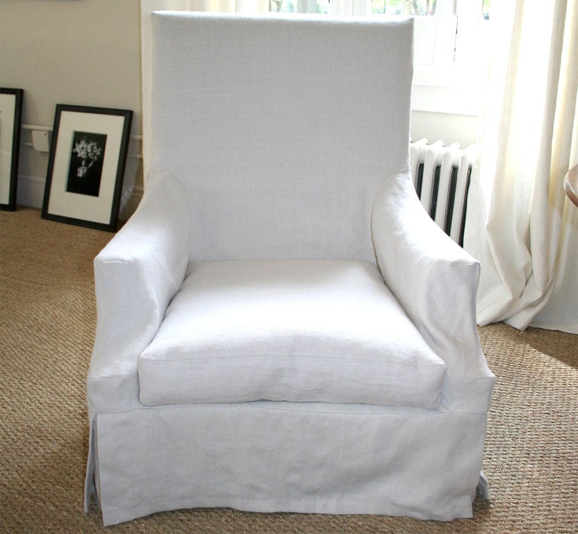 A custom-made armchair with slipcover. C.O.M. available: 7 yds. required. Price does not include textile.