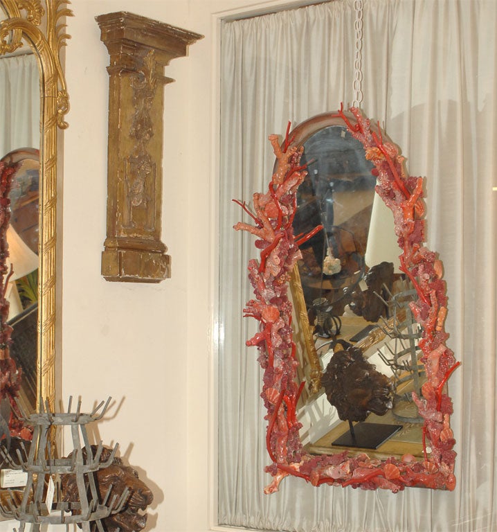 Contemporary red coral mirror made by Ron Morgan.  Ron Morgan is a succesful designer, antique dealer and floral designer.  He has written several books and lectures nationally.  Without doubt one of the most creative people on the West Coast.