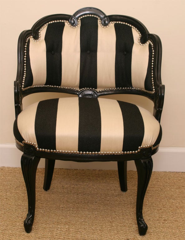 Black lacquered french inspired boudoir chair with elegant black and cream striped upholstery. Chrome tacks are used adding sophistication and functionality.