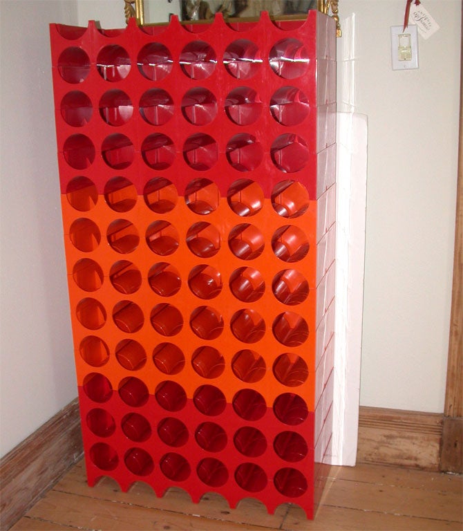 Colorful plastic units make up a stackable wine rack - 4 feet tall as shown
