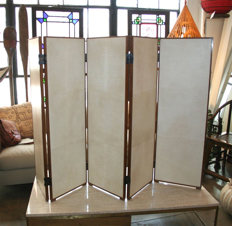 A 5 panel wood and parchment folding screen