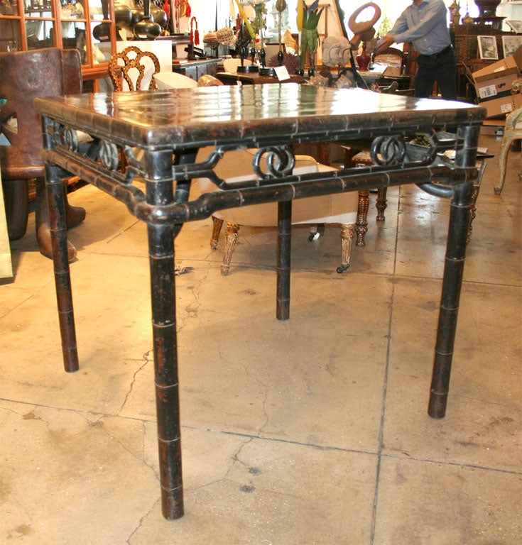A black lacqured square table