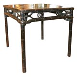 A black lacqured square table