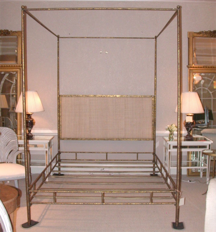 Attractive and well made hammered steel 4-poster bed frame with gold finish and raffia headboard.