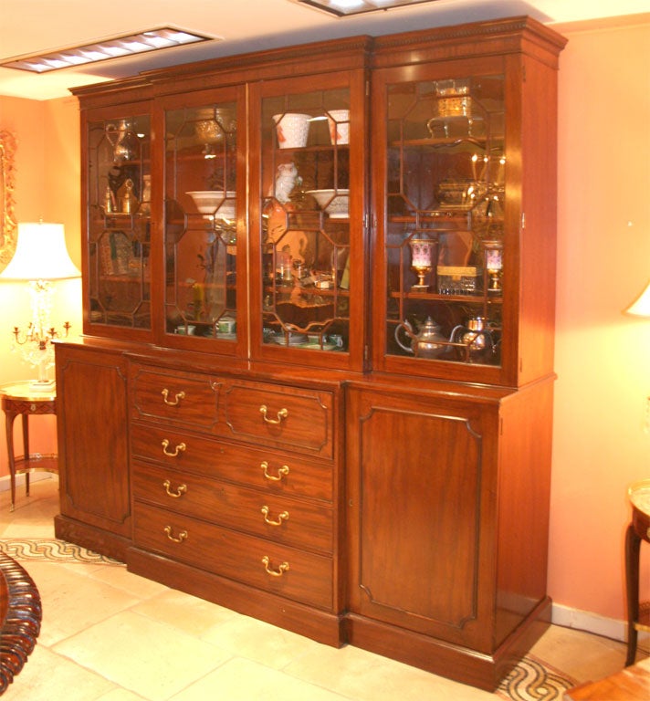 George III 9 Part Mahogany Butlers Breakfront Bookcase with Dentil Crown, Inlaid and fitted interior on plinth base.