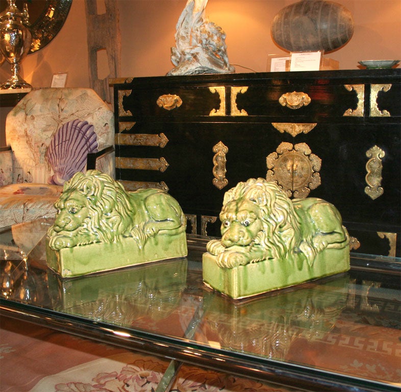 A pair of ceramic lions