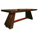 A french 1940's mahogany dining table in the style of Maxime Old