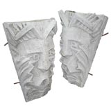 Pair of conrete decorative tribal heads
