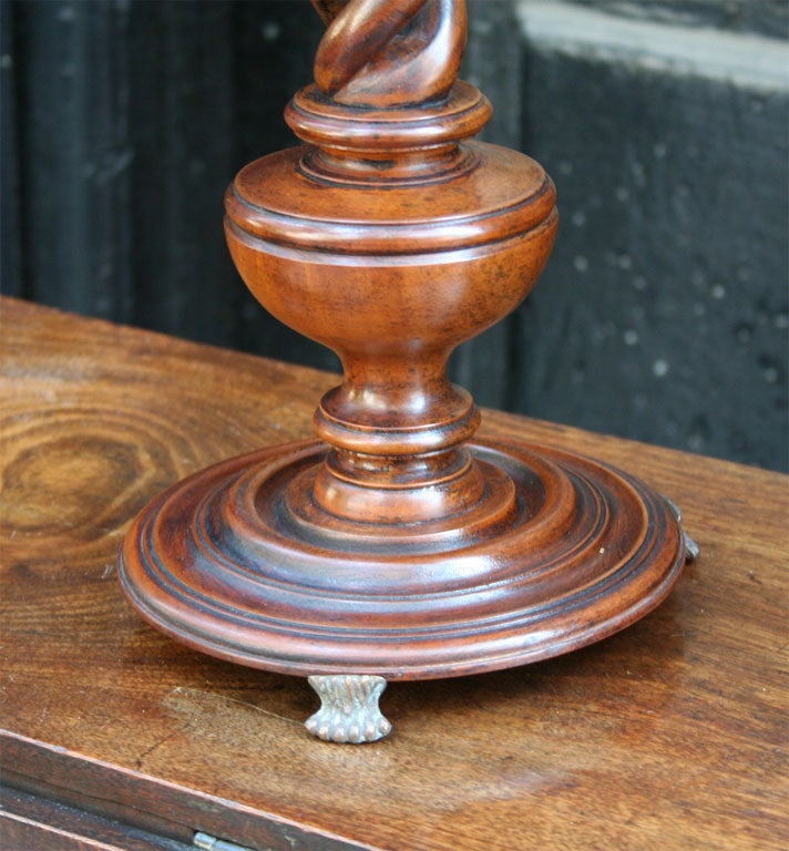 Very fine quality 19th C turned walnut double barley twist candlesticks with filigreed brass boboches on turned bases on paw feet.