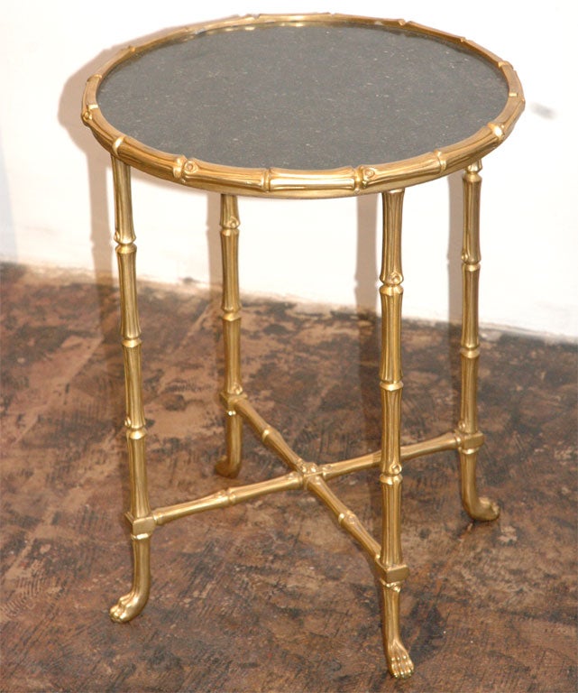 A gilt bronze and marble gueridon by Maison Baguès