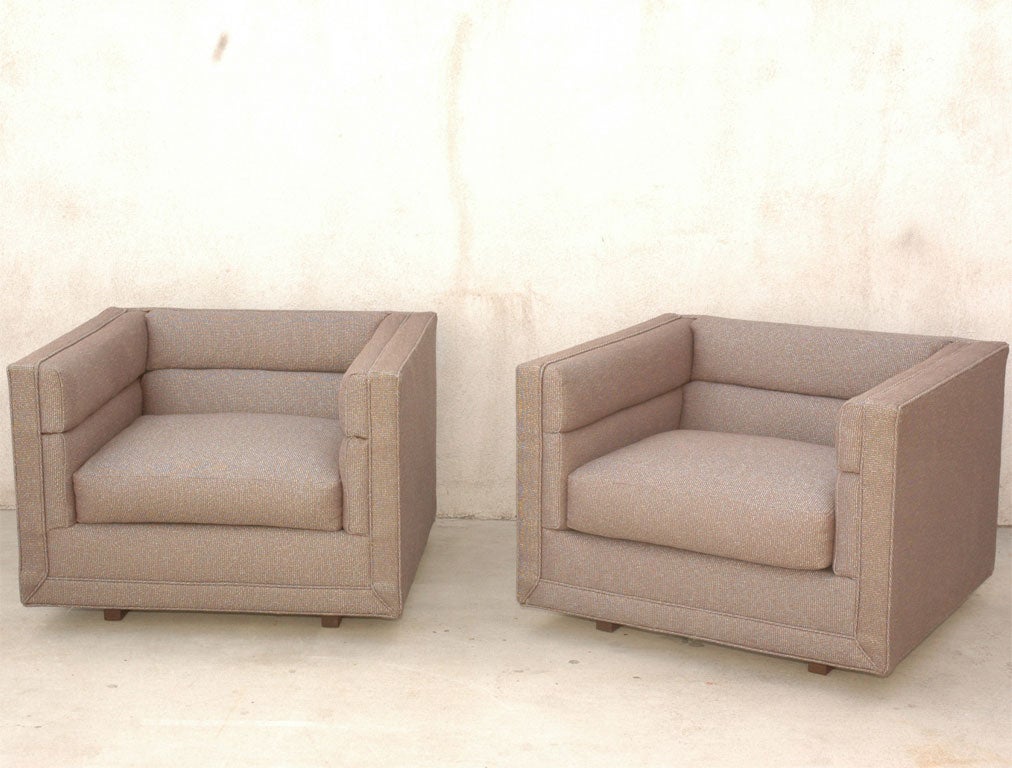 Pair of Tuxedo club chairs by Edward Wormley for Dunbar.  Impressive in size and scale and floating on walnut plynth bases.