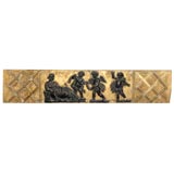 Parcel Ebonized Giltwood Relief Panel