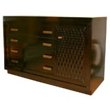 Dark credenza with woven wood door