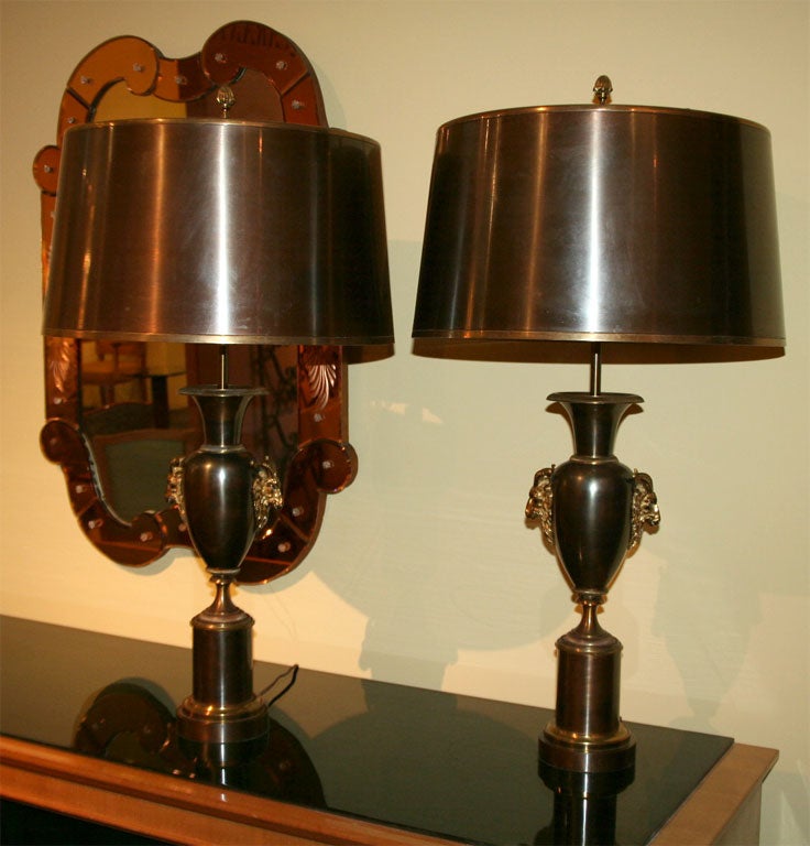 “Ram’s head”, Pair of brass & bronze Lamps by Maison Charles<br />
with their original nickeled shade. Signed Charles.
