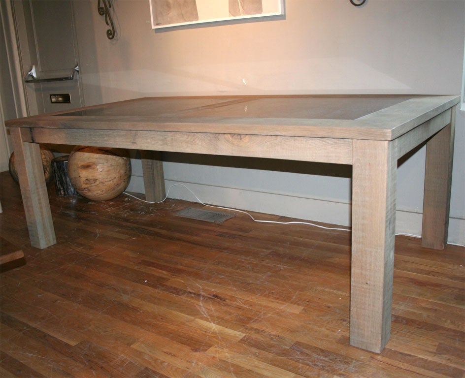Substantial dining table in teak with inset bluestone. Can be made in any size.