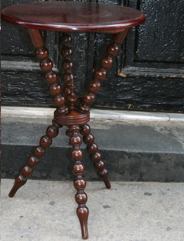 A late 19th century English Arts & Crafts round top bobbin turned gypsy table.  A highly decorative form.  Useful scale.