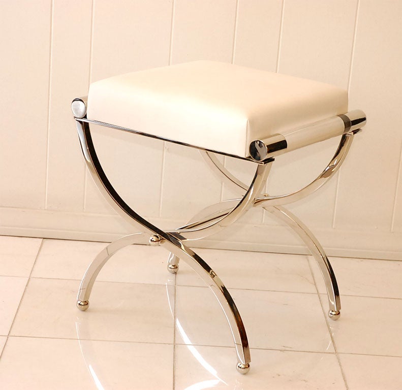 A Charles Hollis Jones Empire Stool in nickel, white leather and Lucite. The sides are accented with an impressive cylindrical Lucite rod that is 1 /1/2