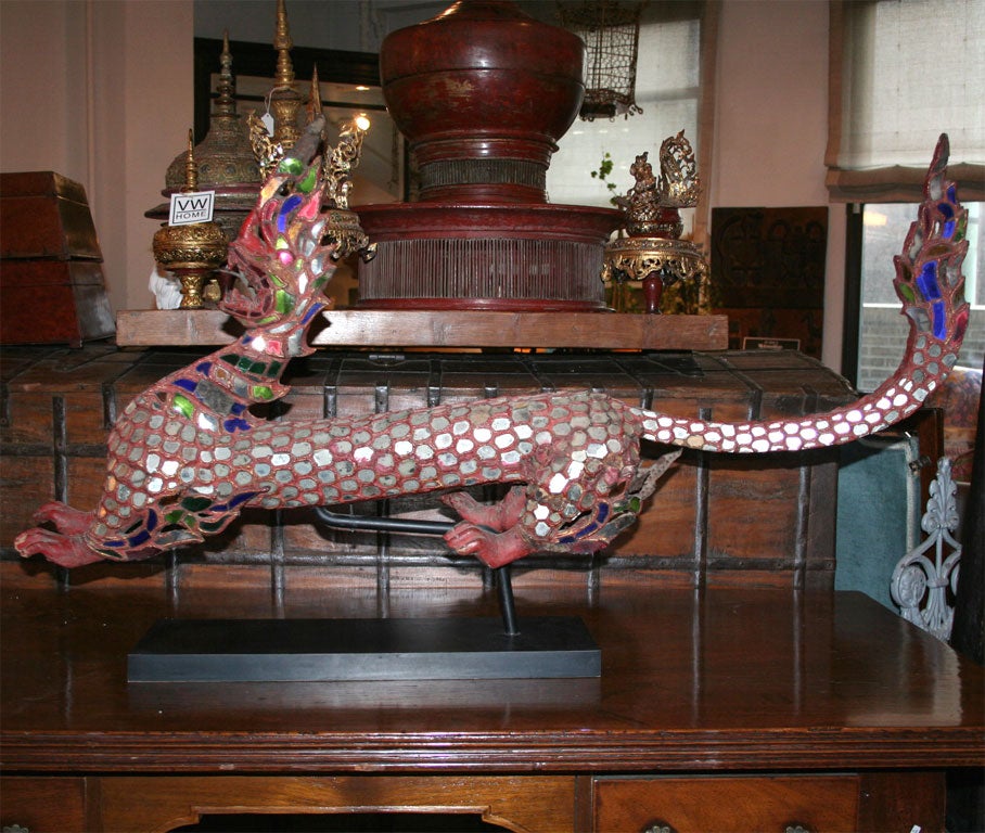 A Burmese Dragon in red with color glass and mirror details