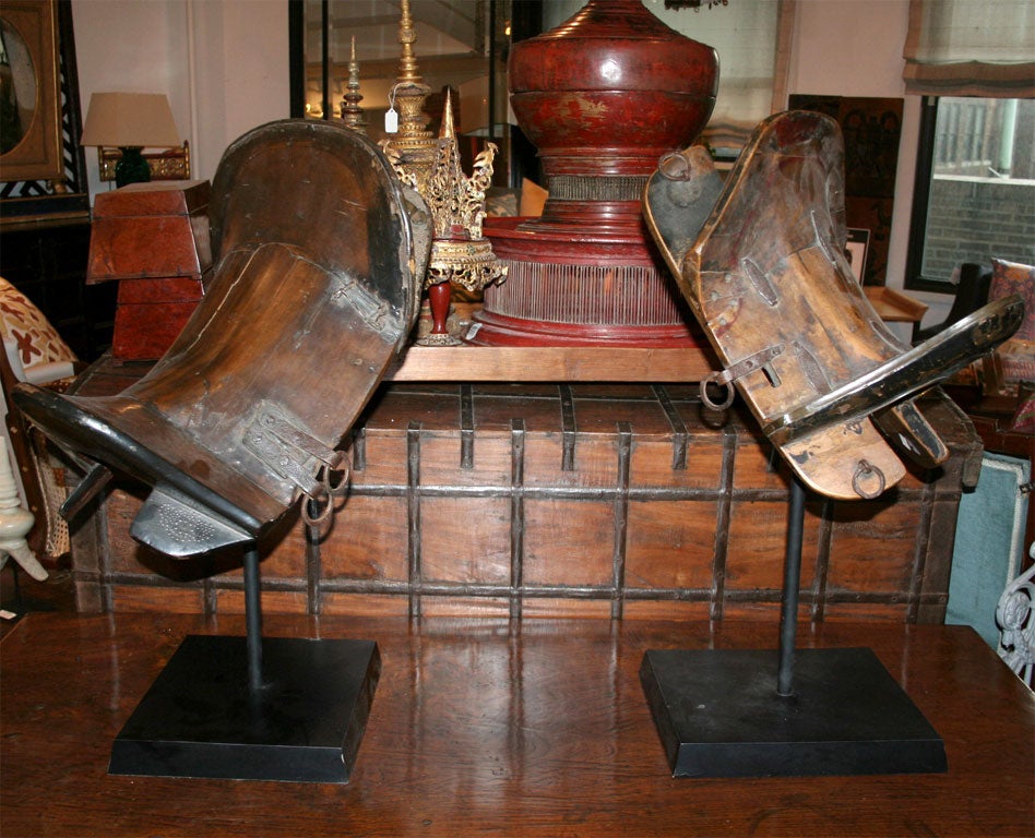 A Chinese horse saddle on a stand