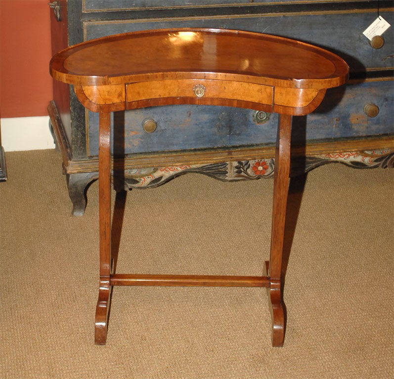 Italian kidney shaped one drawer walnut table with rosewood and burl elm