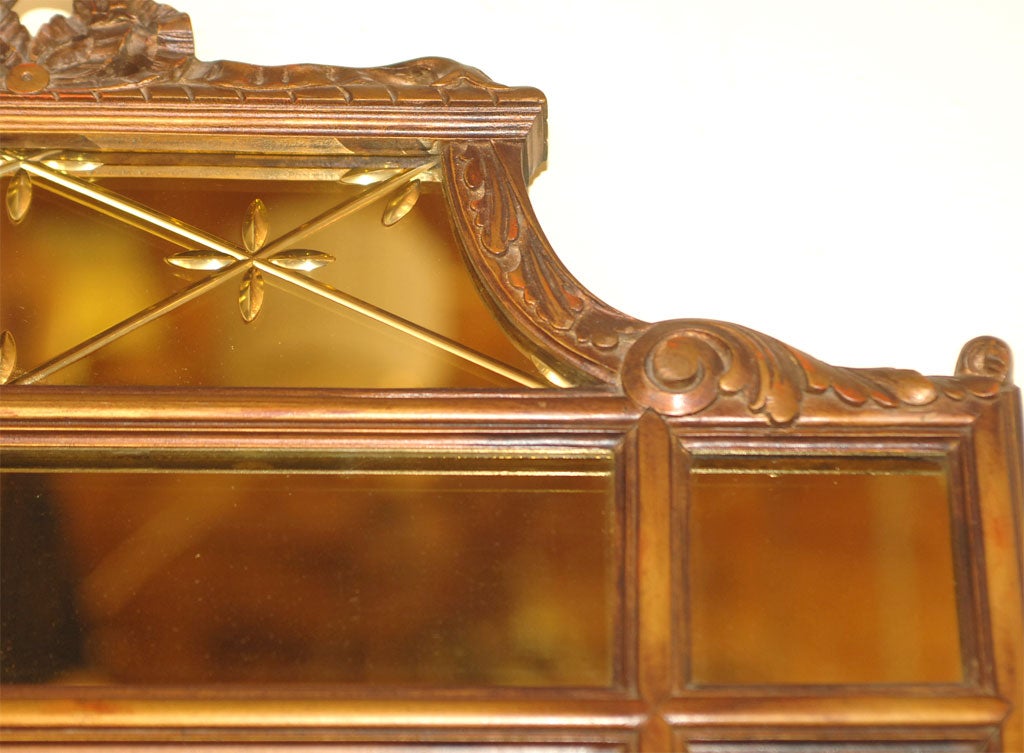 Gold framed sectioned mirror, top centre section with etched cross hatch design. Silvered center mirror framed by amber mirror panels. In excellent original condition. American, early 20th century.