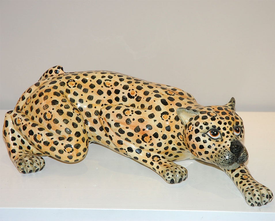 This ceramic has a wonderful pose of a leopard stalking. The hand painted colors are brilliant.