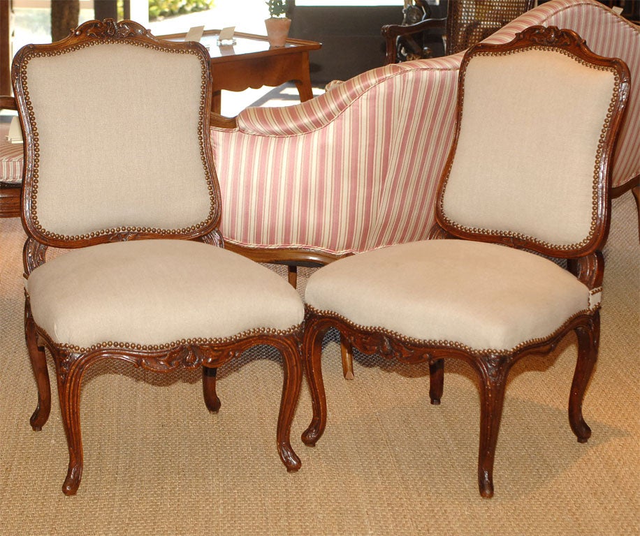 A Pair of Louis XV Carved Walnut Upholstered Chairs. 18th Century.