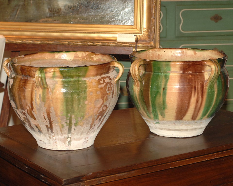 Pair of green,yellow and brown glazed terra-cotta urns with handles from Provence - late nineteenth century
