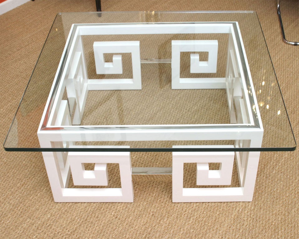 White lacquered square cocktail table with nickel silver banding surrounding the top and connecting the keys.