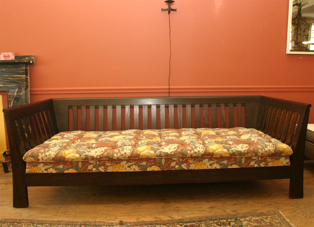 Long, deep mission box settle, with even arm and back of open slat design.  Original cotton and horsehair filled box cushion. These are really deep and comfortable. See other listings for matching settle and club chairs. Produced by Payne furniture