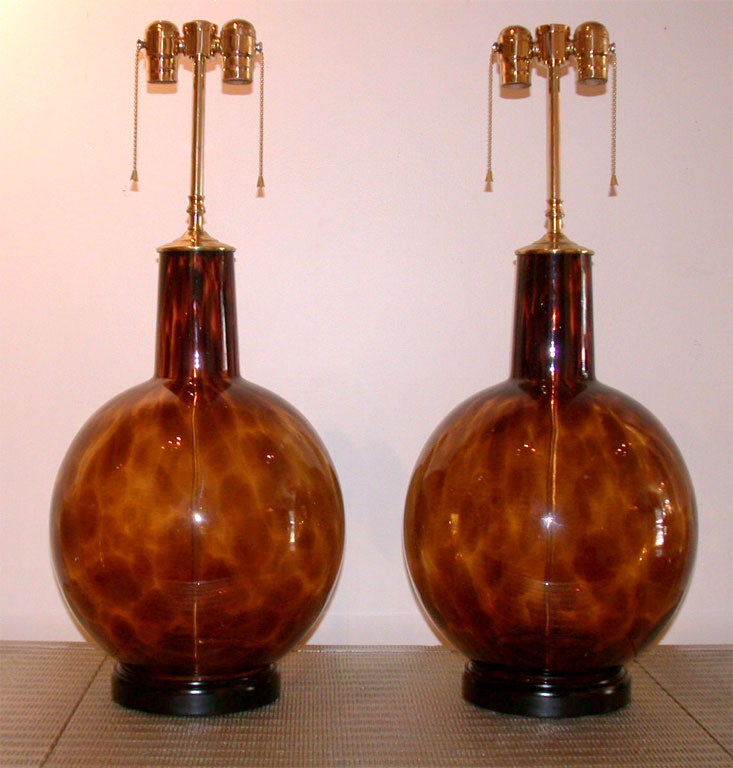 Wonderfully large pair of blown glass tortoise shell lamps which have been newly rewired with double clusters and silk rayon cords.