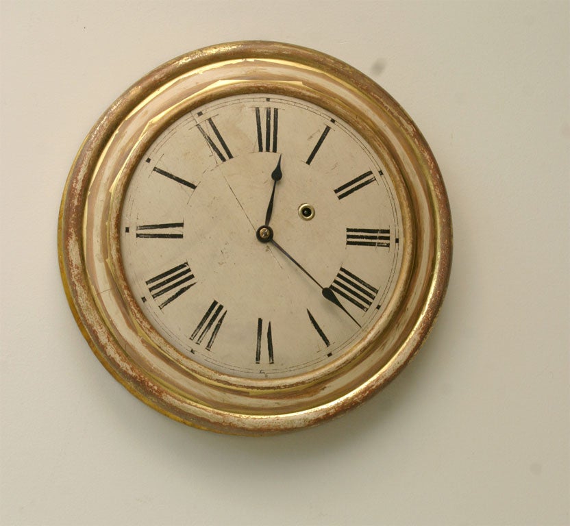 wood gallery clock with traces of gilt surface<br />
original wood painted dial<br />
eight day time - no strike<br />
early version designed without glass
