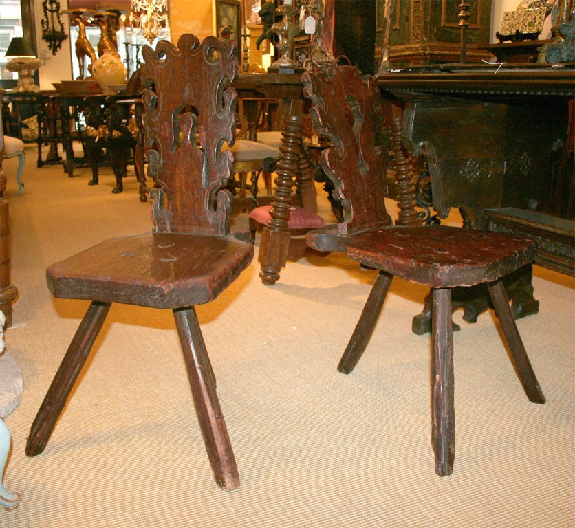 Two 16th century Northern Italian three legged chairs