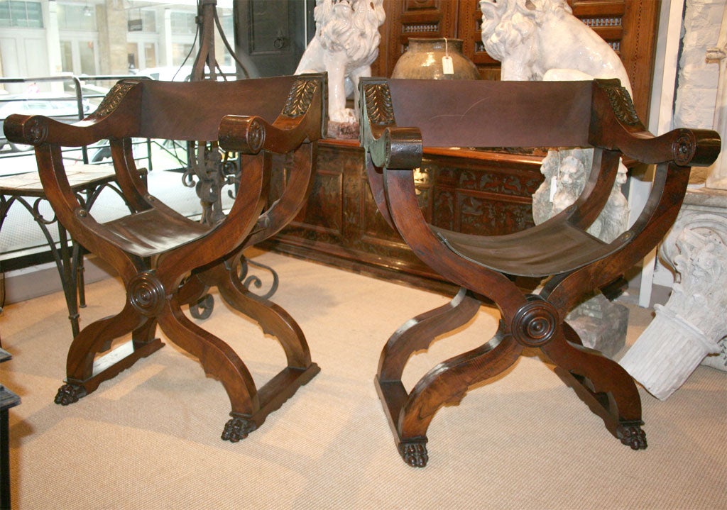 Pair of 19th century Italian Dante armchairs of walnut with leather backs and seats