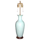 A turquoise pottery vase mounted as a lamp