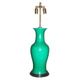 Chinse green pottery vase mounted as lamp on dark wood base