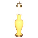 Yellow pottery vase mounted as a lamp on giltwood base
