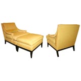 A pair of American fully upholstered open armchairs with ottoman