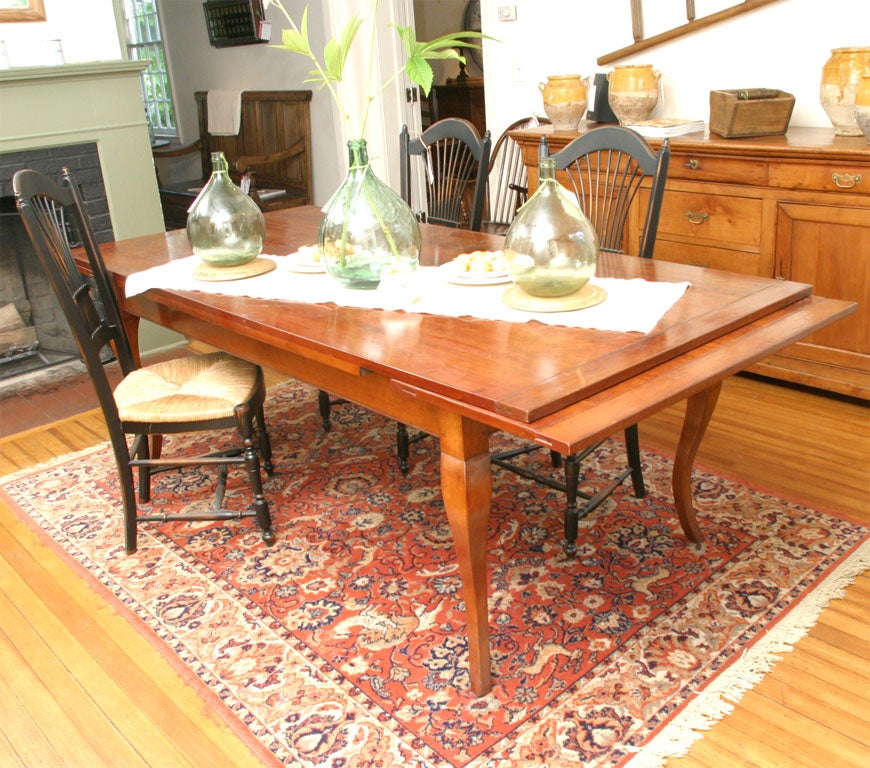 This table can be made to your specifications. The two leaves are self stored and pull-out. Each leaf has breadboard ends. You can choose your own style of legs and each table has a 4