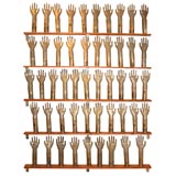 Collection of galvanised copper hands: glove moulds