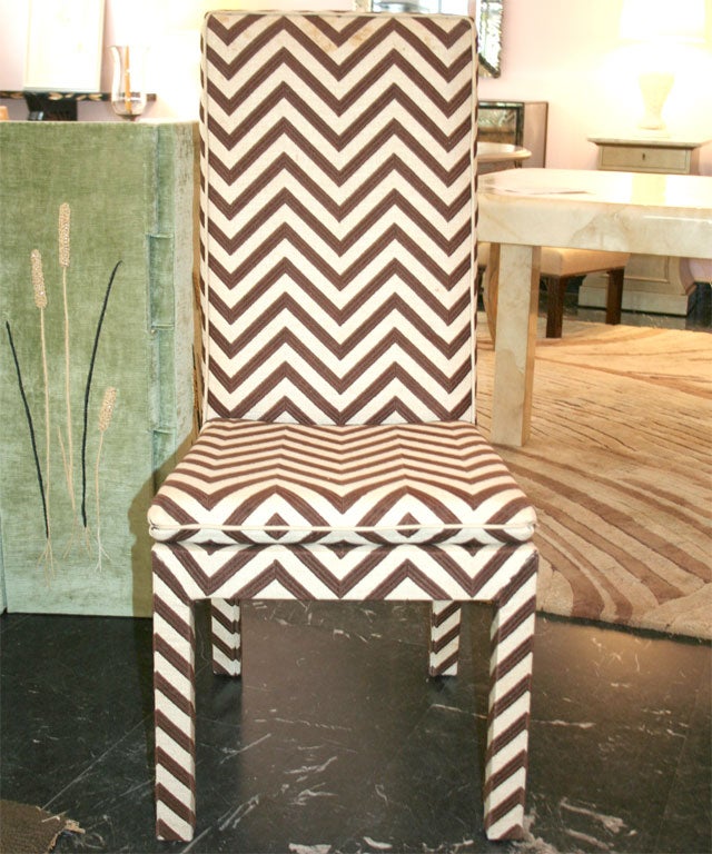 Set of four custom-made side chairs upholstered in a brown and beige chevron pattern raffia.