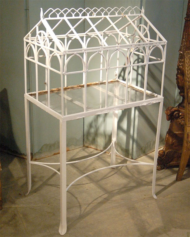 A Victorian painted iron Terrarium with a glass bottom