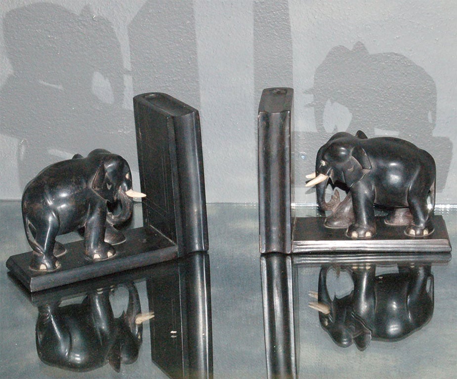 Sweet set of bookends with secret little compartments! Elephant miniatures animate each piece with oodles of character.